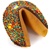Dark Chocolate covered giant fortune cookie with birthday candies and bright confetti sprinkles
