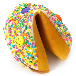 White Chocolate covered giant fortune cookie with colorful stars and smiley faces