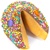 Milk Chocolate covered giant fortune cookie decorated with colorful stars and fun smiley faces