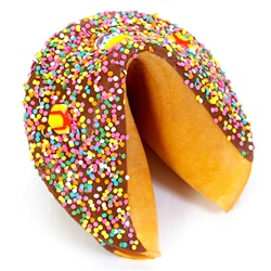 Milk Chocolate covered giant fortune cookie with birthday candies and pastel sprinkles