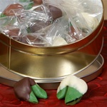 Green fortune cookies covered in milk, white and dark chocolate, the perfect gift for passing along the luck of the Irish